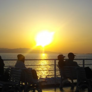Enjoy the sunset while approaching Aigina Island, Greece