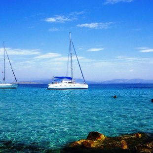 Yachts mooring at the calm bay of Souvala, Loutra beach, Aigina island Greece