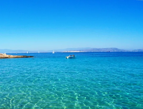 Enjoy a swim in the blue waters of Loutra sandy beach! 