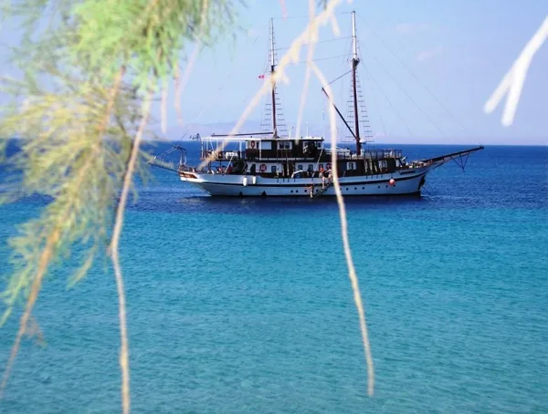 Swimming in the extraordinary turquoise water of Loutra beach, Souvala, Aegina island, Gr