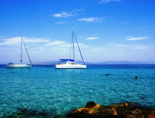 Yachts mooring at the calm bay of Souvala, Loutra beach, Aigina island Greece